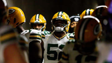 Jan 9, 2022; Detroit, Michigan, USA; Green Bay Packers outside linebacker Rashan Gary (52) walks down the tunnel to the field with his teammates before the game against the Detroit Lions at Ford Field. Mandatory Credit: Raj Mehta-USA TODAY Sports