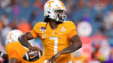 MIAMI GARDENS, FLORIDA - DECEMBER 30: Joe Milton III #7 of the Tennessee Volunteers throws a pass against the Clemson Tigers during the first half in the Capital One Orange Bowl at Hard Rock Stadium on December 30, 2022 in Miami Gardens, Florida. (Photo by Megan Briggs/Getty Images)