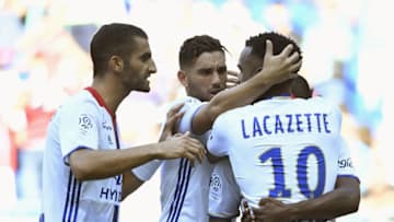 Lyon's French forward Alexandre Lacazette (R) is congratuled by teammates after scoring during the French L1 football match Olympique Lyonnais against Girondins de Bordeaux on September 10, 2016, at the Parc Olympique Lyonnais stadium in Decines-Charpieu near Lyon, southeastern France. / AFP / PHILIPPE DESMAZES (Photo credit should read PHILIPPE DESMAZES/AFP/Getty Images)