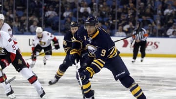 Mar 18, 2016; Buffalo, NY, USA; Buffalo Sabres left wing Evander Kane (9) skates up ice with the puck during the second period against the Ottawa Senators at First Niagara Center. Mandatory Credit: Timothy T. Ludwig-USA TODAY Sports