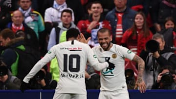 Dani Alves and Neymar. (Photo by Martin BUREAU / AFP) (Photo credit should read MARTIN BUREAU/AFP via Getty Images)