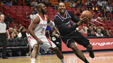 The Miami Heat's James Johnson drives to the basket against the Houston Rockets' Chris Paul (Michael Laughlin/Sun Sentinel/TNS via Getty Images)