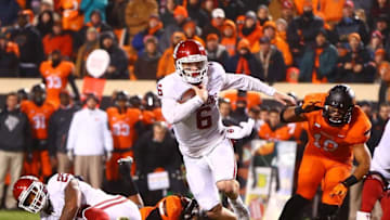 Nov 28, 2015; Stillwater, OK, USA; Oklahoma Sooners quarterback Baker Mayfield (6) runs the ball for a touchdown against the Oklahoma State Cowboys at Boone Pickens Stadium. The Sooners defeated the Cowboys 58-23. Mandatory Credit: Mark J. Rebilas-USA TODAY Sports