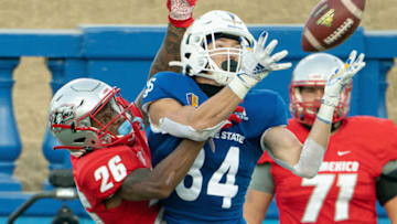 Oct 31, 2020; San Jose, California, USA; New Mexico Lobos cornerback Nic Wilson (26) defends against San Jose State Spartans wide receiver Bailey Gaither (84) during the second quarter at CEFCU Stadium. Mandatory Credit: Stan Szeto-USA TODAY Sports
