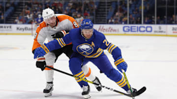 Sep 27, 2022; Buffalo, New York, USA; Buffalo Sabres right wing Kyle Okposo (21) carries the puck as Philadelphia Flyers defenseman Kevin Connauton (8) defends during the second period at KeyBank Center. Mandatory Credit: Timothy T. Ludwig-USA TODAY Sports