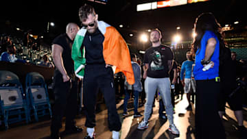 LAS VEGAS, NEVADA - DECEMBER 11: (L-R) Conor McGregor of Ireland waits backstage with his coach John Kavanaugh during the UFC 194 Weigh-in event at the MGM Grand Garden Arena on December 11, 2015 in Las Vegas, Nevada. (Photo by Jeff Bottari/Zuffa LLC/Zuffa LLC via Getty Images)