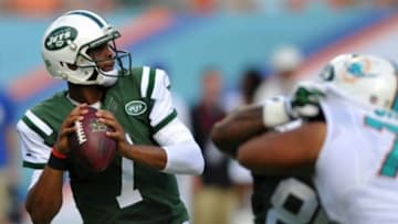 Dec 28, 2014; Miami Gardens, FL, USA; New York Jets quarterback Geno Smith (7) throws a pass against the Miami Dolphins during the first half at Sun Life Stadium. Mandatory Credit: Steve Mitchell-USA TODAY Sports