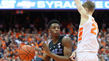 SYRACUSE, NY - FEBRUARY 23: RJ Barrett #5 of the Duke Blue Devils looks to pass the ball around Marek Dolezaj #21 of the Syracuse Orange during the first half at the Carrier Dome on February 23, 2019 in Syracuse, New York. (Photo by Rich Barnes/Getty Images)