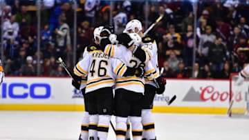 Nov 13, 2016; Denver, CO, USA; Boston Bruins center Dominic Moore (28) celebrates his empty net goal with defenseman Zdeno Chara (33) and center David Krejci (46) in the third period against the Colorado Avalanche at Pepsi Center. The Bruins defeated the Avalanche 2-0. Mandatory Credit: Ron Chenoy-USA TODAY Sports