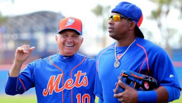Feb 26, 2016; Port St. Lucie, FL, USA; New York Mets manager Terry Collins (left) laughs as New York Mets left fielder Yoenis Cespedes (right) arrives at Tradition Field. Mandatory Credit: Steve Mitchell-USA TODAY Sports