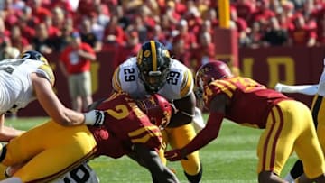 Sep 12, 2015; Ames, IA, USA; Iowa State Cyclones linebacker Jordan Harris (2) tackles Iowa Hawkeyes running back LeShun Daniels Jr. (29) at Jack Trice Stadium. Mandatory Credit: Reese Strickland-USA TODAY Sports