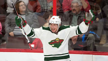 Mar 15, 2016; Ottawa, Ontario, CAN; Minnesota Wild left wing Ryan Carter (18) ceelebrates his goal scored against Ottawa Senators goalie Craig Anderson (41) in the third period at the Canadian Tire Centre. The Senators defeated the Minnesota Wild 3-2 in overtime. Mandatory Credit: Marc DesRosiers-USA TODAY Sports