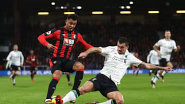 BOURNEMOUTH, ENGLAND - DECEMBER 17: Dejan Lovren of Liverpool tackles Joshua King of AFC Bournemouth during the Premier League match between AFC Bournemouth and Liverpool at Vitality Stadium on December 17, 2017 in Bournemouth, England. (Photo by Bryn Lennon/Getty Images)