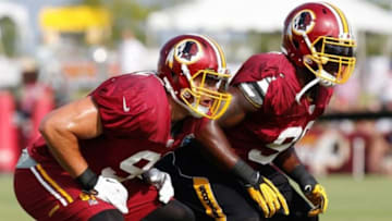 Jul 25, 2014; Richmond, VA, USA; Washington Redskins outside linebacker Ryan Kerrigan (91) and Redskins outside linebacker Brian Orakpo (98) line up during practice on day three of training camp at Bon Secours Washington Redskins Training Center. Mandatory Credit: Geoff Burke-USA TODAY Sports