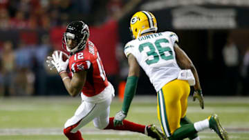 ATLANTA, GA - JANUARY 22: Atlanta Falcons wide receiver Mohamed Sanu (12) is pursued by Green Bay Packers cornerback LaDarius Gunter (36) after a reception in the first half of the NFC Championship game between the Green Bay Packers and Atlanta Falcons on January 22, 2017, at the Georgia Dome in Atlanta, GA. The Atlanta Falcons won the game 44-21. (Photo by Todd Kirkland/Icon Sportswire via Getty Images)