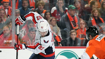 PHILADELPHIA, PA - NOVEMBER 13: Evgeny Kuznetsov #92 of the Washington Capitals skates the puck against Travis Sanheim #6 of the Philadelphia Flyers on November 13, 2019 at the Wells Fargo Center in Philadelphia, Pennsylvania. (Photo by Len Redkoles/NHLI via Getty Images)