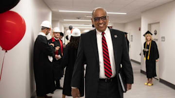 Neville Pinto, the 30th president of the University of Cincinnati walks down the hall in the Fifth Third Arena. The Enquirer.
