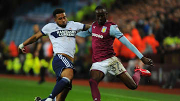 BIRMINGHAM, ENGLAND - SEPTEMBER 12: Albert Adomah of Aston Villa is tackled by Cyrus Christie of Middlesbrough during the Sky Bet Championship match between Aston Villa and Middlesbrough at Villa Park on September 12, 2017 in Birmingham, England. (Photo by Nathan Stirk/Getty Images,)