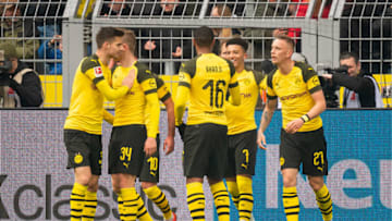 DORTMUND, GERMANY - APRIL 13: Jadon Sancho of Borussia Dortmund celebrates after scoring his team's first goal with team mates during the Bundesliga match between Borussia Dortmund and 1. FSV Mainz 05 at Signal Iduna Park on April 13, 2019 in Dortmund, Germany. (Photo by TF-Images/Getty Images)