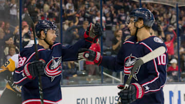 COLUMBUS, OH - SEPTEMBER 28: Columbus Blue Jackets right wing Oliver Bjorkstrand (28) celebrates with Columbus Blue Jackets center Alexander Wennberg (10) after scoring a goal in the third period of a game between the Columbus Blue Jackets and the Pittsburgh Penguins on September 28, 2018 at Nationwide Arena in Columbus, OH. The Blue Jackets won 7-6. (Photo by Adam Lacy/Icon Sportswire via Getty Images)