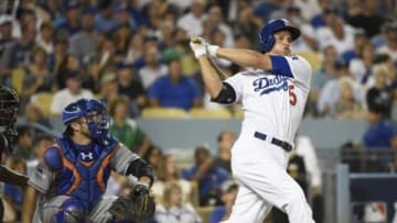 October 9, 2015; Los Angeles, CA, USA; Los Angeles Dodgers shortstop Corey Seager (5) hits a ground rule double in the third inning against the New York Mets in game one of the NLDS at Dodger Stadium. Mandatory Credit: Richard Mackson-USA TODAY Sports
