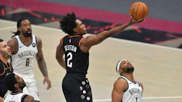 CLEVELAND, OHIO - JANUARY 22: Collin Sexton #2 of the Cleveland Cavaliers shoots over Bruce Brown #1 of the Brooklyn Nets during the first quarter at Rocket Mortgage Fieldhouse on January 22, 2021 in Cleveland, Ohio. NOTE TO USER: User expressly acknowledges and agrees that, by downloading and/or using this photograph, user is consenting to the terms and conditions of the Getty Images License Agreement. (Photo by Jason Miller/Getty Images)