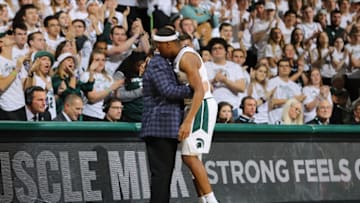 EAST LANSING, MI - NOVEMBER 10: Head coach Tom Izzo of the Michigan State Spartans hugs Cassius Winston #5 during the second half against the Binghamton Bearcats at Breslin Center on November 10, 2019 in East Lansing, Michigan. (Photo by Rey Del Rio/Getty Images)