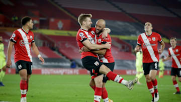 SOUTHAMPTON, ENGLAND - NOVEMBER 06: Nathan Redmond of Southampton congratulates team-mate Stuart Armstrong after he scores a goal to make it 2-0 during the Premier League match between Southampton and Newcastle United at St Mary's Stadium on November 06, 2020 in Southampton, England. Sporting stadiums around the UK remain under strict restrictions due to the Coronavirus Pandemic as Government social distancing laws prohibit fans inside venues resulting in games being played behind closed doors. (Photo by Robin Jones/Getty Images)