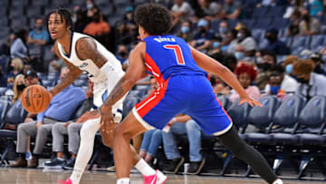 Memphis Grizzlies guard Ja Morant (12) controls the ball against Detroit Pistons guard Killian Hayes (7) Credit: Justin Ford-USA TODAY Sports