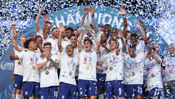 Gio Reyna lifts the Nations League trophy (Photo by Jamie Schwaberow/ISI Photos/Getty Images)