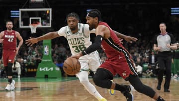 May 17, 2023; Boston, Massachusetts, USA; Miami Heat guard Gabe Vincent (2) drives against Boston Celtics guard Marcus Smart (36) during the first quarter in game one of the Eastern Conference Finals for the 2023 NBA playoffs at TD Garden. Mandatory Credit: Bob DeChiara-USA TODAY Sports