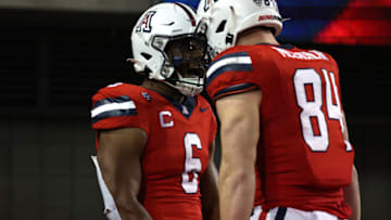 Oct 28, 2023; Tucson, Arizona, USA; Arizona Wildcats running back Michael Wiley #6 celebrates a touchdown with tight end Tanner McLachlan #84 during the second half at Arizona Stadium. Mandatory Credit: Zachary BonDurant-USA TODAY Sports