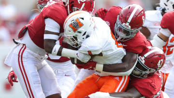 TUSCALOOSA, ALABAMA - SEPTEMBER 11: DeMarcco Hellams #2, Christian Harris #8, and Byron Young #47 of the Alabama Crimson Tide tackle Brandon Marshall #8 of the Mercer Bears during the first half at Bryant-Denny Stadium on September 11, 2021 in Tuscaloosa, Alabama. (Photo by Kevin C. Cox/Getty Images)