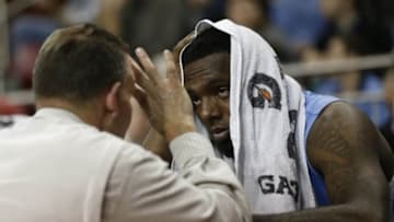 Jan 29, 2013; Chestnut Hill, Massachusetts, USA; North Carolina Tar Heels guard P.J. Hairston (15) talks with trainer Chris Hirth after returning to the bench during the second half against the Boston College Eagles at Conte Forum. The North Carolina Tar Heels won 82-70. Mandatory Credit: Greg M. Cooper-USA TODAY Sports