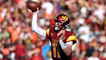 LANDOVER, MARYLAND - JANUARY 01: Carson Wentz #11 of the Washington Commanders throws a pass during the first quarter against the Cleveland Browns at FedExField on January 01, 2023 in Landover, Maryland. (Photo by Todd Olszewski/Getty Images)