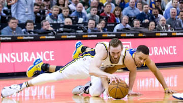 Mar 30, 2016; Salt Lake City, UT, USA; Utah Jazz forward Gordon Hayward (20) and Golden State Warriors guard Stephen Curry (30) battle for a loose ball during the second half at Vivint Smart Home Arena. Golden State won in overtime 103-96. Mandatory Credit: Russ Isabella-USA TODAY Sports
