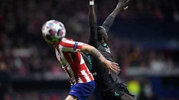 Liverpool's Senegalese striker Sadio Mane (R) challenges Atletico Madrid's Croatian defender Sime Vrsaljko during the UEFA Champions League, round of 16, first leg football match between Club Atletico de Madrid and Liverpool FC at the Wanda Metropolitano stadium in Madrid on February 18, 2020. (Photo by OSCAR DEL POZO / AFP) (Photo by OSCAR DEL POZO/AFP via Getty Images)