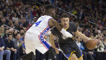 PHILADELPHIA, PA - JANUARY 30: Klay Thompson #11 of the Golden State Warriors drives around Nerlens Noel #4 of the Philadelphia 76ers on January 30, 2016 at the Wells Fargo Center in Philadelphia, Pennsylvania. NOTE TO USER: User expressly acknowledges and agrees that, by downloading and or using this photograph, User is consenting to the terms and conditions of the Getty Images License Agreement. (Photo by Mitchell Leff/Getty Images)
