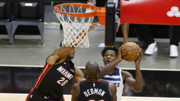 Miami Heat forward Andre Iguodala (28) and center Dewayne Dedmon (21) defend Minnesota Timberwolves guard Anthony Edwards (rear)(Rhona Wise-USA TODAY Sports)
