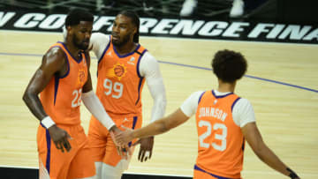 Jun 24, 2021; Los Angeles, California, USA; Phoenix Suns center Deandre Ayton (22) reacts with forward Jae Crowder (99) and forward Cameron Johnson (23) after drawing a foul against the Los Angeles Clippers during the first half in game three of the Western Conference Finals for the 2021 NBA Playoffs at Staples Center. Mandatory Credit: Gary A. Vasquez-USA TODAY Sports