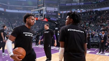 SACRAMENTO, CA - MARCH 25: Buddy Hield #24 and De'Aaron Fox #5 of the Sacramento Kings warm up with a shirt to honor Stephon Clark during the game against the Boston Celtics on March 25, 2018 at Golden 1 Center in Sacramento, California. NOTE TO USER: User expressly acknowledges and agrees that, by downloading and or using this photograph, User is consenting to the terms and conditions of the Getty Images Agreement. Mandatory Copyright Notice: Copyright 2018 NBAE (Photo by Rocky Widner/NBAE via Getty Images)