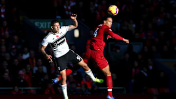 LIVERPOOL, ENGLAND - NOVEMBER 11: Aleksandar Mitrovic of Fulham battles for possession with Virgil van Dijk of Liverpool during the Premier League match between Liverpool FC and Fulham FC at Anfield on November 11, 2018 in Liverpool, United Kingdom. (Photo by Alex Livesey/Getty Images)