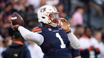 Auburn football quarterback T.J. Finley (1) warms up before Auburn Tigers take on Alabama Crimson Tide at Jordan-Hare Stadium in Auburn, Ala., on Saturday, Nov. 27, 2021.