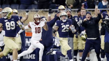 SOUTH BEND, IN - NOVEMBER 23: Braden Lenzy #25 of the Notre Dame Fighting Irish runs downfield for 61-yard touchdown ahead of Brandon Sebastian #10 of the Boston College Eagles during a game at Notre Dame Stadium on November 23, 2019 in South Bend, Indiana. Notre Dame defeated Boston College 40-7. (Photo by Joe Robbins/Getty Images)