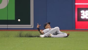 TORONTO, ON - JULY 1: Leonys Martin #12 of the Detroit Tigers is unable to hold on to a line drive to center field and cannot make the catch in the fourth inning during MLB game action as Kevin Pillar #11 of the Toronto Blue Jays hits a single at Rogers Centre on July 1, 2018 in Toronto, Canada. (Photo by Tom Szczerbowski/Getty Images)