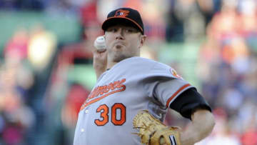 Jun 14, 2016; Boston, MA, USA; Baltimore Orioles starting pitcher Chris Tillman (30) pitches during the first inning against the Boston Red Sox at Fenway Park. Mandatory Credit: Bob DeChiara-USA TODAY Sports