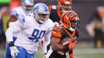 CINCINNATI, OH - DECEMBER 24: Giovani Bernard #25 of the Cincinnati Bengals runs with the ball chased by Cornelius Washington #90 of the Detroit Lions during the second half at Paul Brown Stadium on December 24, 2017 in Cincinnati, Ohio. (Photo by Joe Robbins/Getty Images)