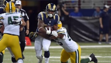 Aug 16, 2014; St. Louis, MO, USA; St. Louis Rams running back Tre Mason (27) is tackled by Green Bay Packers outside linebacker Andy Mulumba (55) during the second half at Edward Jones Dome. Mandatory Credit: Jasen Vinlove-USA TODAY Sports