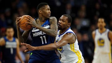 MINNEAPOLIS, MN - MARCH 11: Jamal Crawford #11 of the Minnesota Timberwolves has the ball against Kevin Durant #35 of the Golden State Warriors during the game on March 11, 2018 at the Target Center in Minneapolis, Minnesota. NOTE TO USER: User expressly acknowledges and agrees that, by downloading and or using this Photograph, user is consenting to the terms and conditions of the Getty Images License Agreement. (Photo by Hannah Foslien/Getty Images)