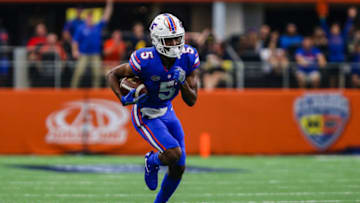 ARLINGTON, TX - SEPTEMBER 02: Florida Gators cornerback CJ Henderson (5) intercepts the football and sprints for the end zone during the game between the Michigan Wolverines and the Florida Gators on September 2, 2017 at AT